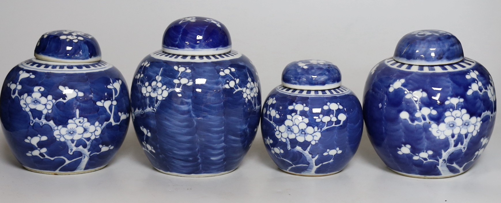 Four Chinese blue and white prunus pattern ginger jars, together with three similar vases. 19th/early 20th century, Tallest 15cm